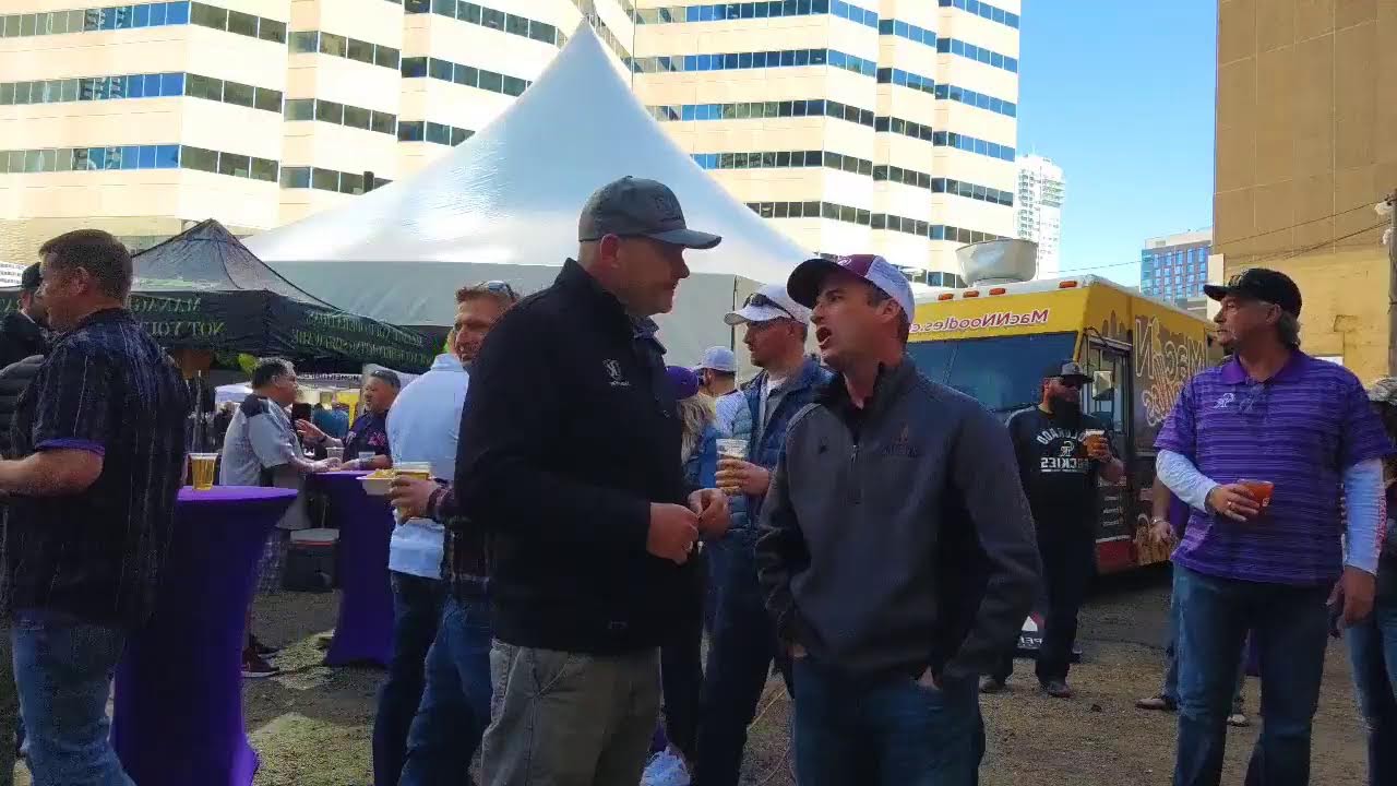 Energy professionals meeting at an outdoor industry tailgate